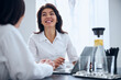 © Viacheslav Yakobchuk - Friendly doctor smiling at her patient during the consultation