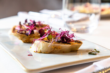 Wall Mural - Slices of cabbage like bruschetta with vegetables and micro-greens.