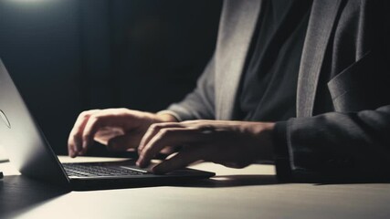 Wall Mural - Night work. Project deadline. Remote job. Freelancer lifestyle. Unrecognizable business man hands typing on laptop late at dark office workplace.