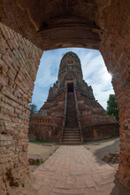 Low Angle Of Ancient Stone Wat Chaiwatthanaram Buddhist Temple With Stairs Leading To Entrance Located In Ayutthaya Historical Park
