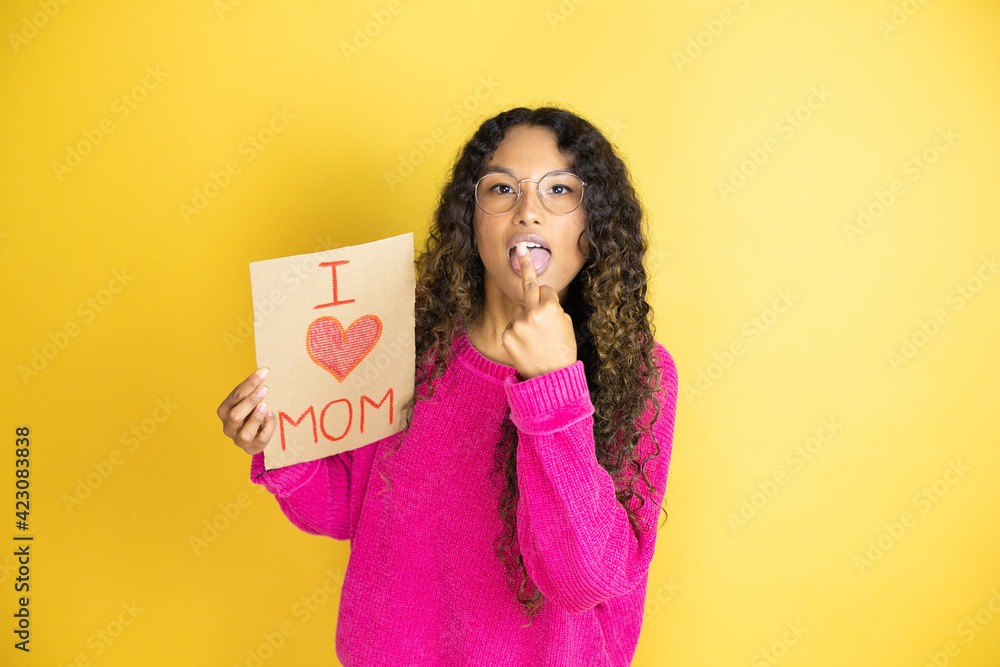 Beautiful woman celebrating mothers day holding poster love mom message ...