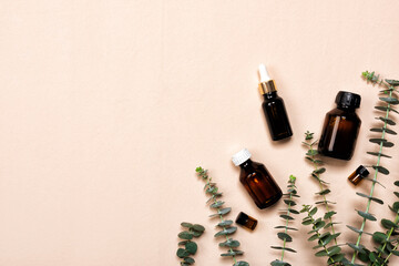 Poster - Glass brown bottles of essence or serum with natural eucalyptus leaves