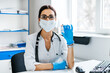 © Тарас Нагирняк - Portrait of a female doctor holding an injection against coronavirus in her hand in a modern hospital