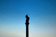 Unicorn Silhouette On Glasgow Cross, Scotland With Blue Sky