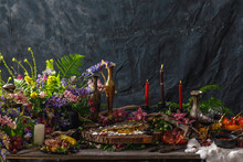 Still Life In Old Masters Style With Fish, Glass Of Wine, Old Dishes, Fruits. The Concept Of A Richly Decorated Table.