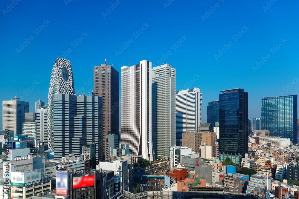 City skyline of modern high-rise buildings under blue clear sunny sky ...