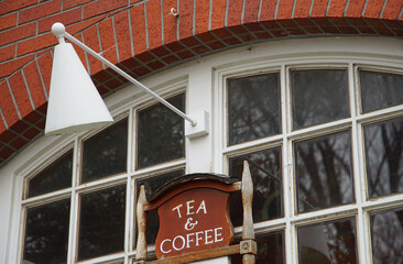 Wall Mural - Lighting, windows and signage of the cafe building