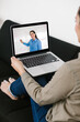© Marcos - mexican woman student watching lesson online and studying from home in Mexico city