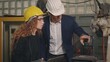 © sorapop - maintenance engineer man and diverse female factory workers talking and present or explain robot welding machine