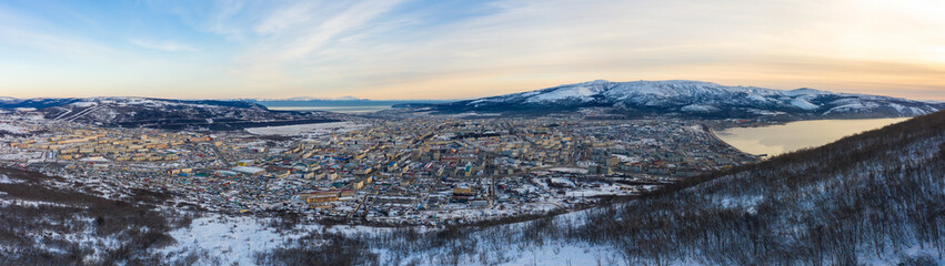Wall Mural - Panorama of the city of Magadan. Aerial view of the Russian northern city on the coast of the Sea of ​​Okhotsk. Top view of the streets and buildings. Magadan, Magadan region, Siberia, Far East Russia