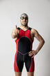 © robcartorres - man wearing triathlon suit white background