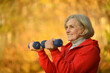 © aletia2011 - fit Senior woman exercising  with dumbbells