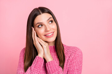 Poster - Portrait of brunette optimistic girl hands head look empty space wear pink sweater isolated on crimson color background