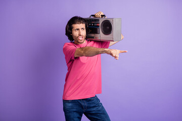 Wall Mural - Photo of funky crazy young guy dressed pink outfit dancing holding boom box pointing finger isolated purple color background