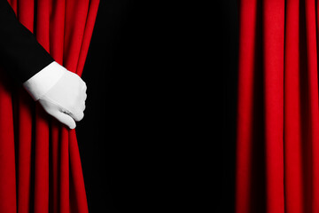 Wall Mural - Person opening red front curtains on black background, closeup. Space for text