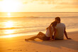 © el.rudakova - Happy Romantic Couple Enjoying Beautiful Sunset at the Beach
