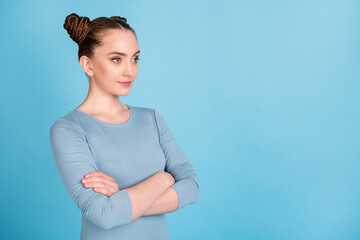 Canvas Print - Photo of sweet pretty young lady dressed casual clothes arms crossed looking empty space isolated blue color background