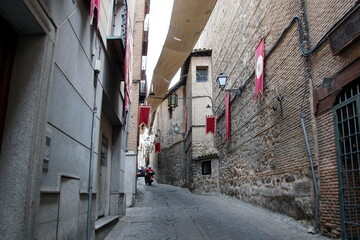 Toledo town street view with historical buildings in Spain.