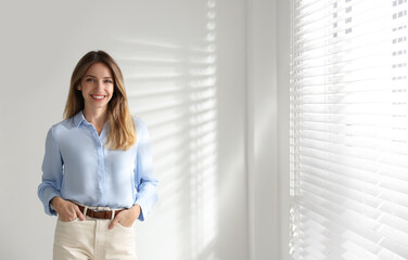 Wall Mural - Portrait of beautiful young businesswoman in office