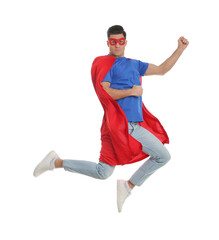 Wall Mural - Man in superhero cape and mask jumping on white background