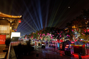 Xi'an, Shaanxi, China - 9 september 2019 : very famous tourist street near the big wild goose pagoda. Chinese night celebrations, illumination in the old capital of China. Xi'an by night