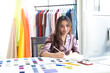 © iploydoy - Young asian creative fashion designer  smiliing and writing an idea on paper in the office after getting an order from customer. Concept of online store, small business, entreprenuer and SME.