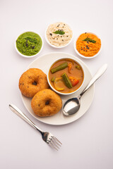 Wall Mural - Medu Vada or sambar vada, a popular South Indian food served with different chutney