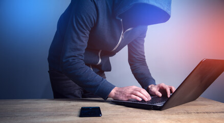 Programmer or computer hacker typing code