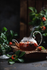 Wall Mural - Rosehip tea with rosehip berries. Rosehip tea kettle