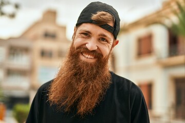 Wall Mural - Young irish hipster man smiling happy standing at the city.