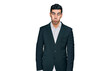 © Krakenimages.com - Handsome hispanic man wearing business clothes making fish face with lips, crazy and comical gesture. funny expression.