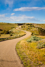 A Winding Paved Road & Panoramic Views Of Dinosaur National Monument In NW Colorado During Summer.  