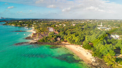 Wall Mural - Aerial view of Grand Baie coastline from drone, Mauritius