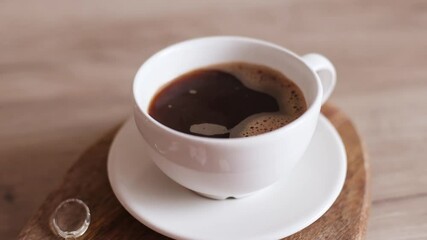 Wall Mural - Aroma coffee cup with natural steam smoke of coffee on wood table background