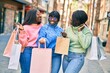 © Krakenimages.com - Three african american friends going shopping at the city.