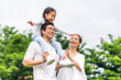Portrait of enjoy happy love asian family father and mother holding cute little asian girl child smiling playing and having fun moments good time in summer park at home