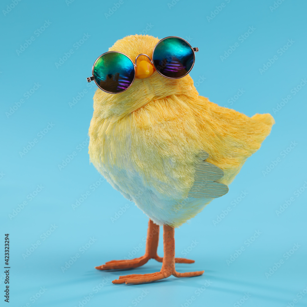 Easter decoration of a yellow chick wearing silly sunglasses. - obrazy, fototapety, plakaty 