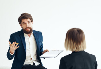 Business man and woman in suit on a light background communication staff job interview