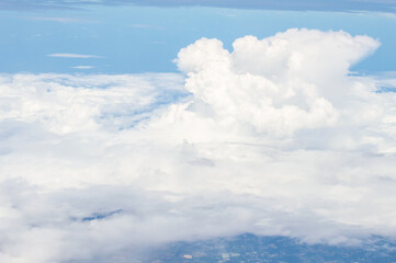 Wall Mural - over the clouds,Blue sky with tiny clouds background Beautiful natural view from airplane window above. Background or Wallpaper.blue sky and cloud sky nature.Top view of aircraft