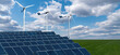 Solar panels and wind turbines on a green field. Sustainable energy concept	

