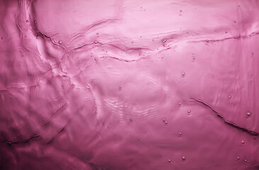 Wall Mural - texture of splashing water on pink background