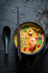 Wall Mural - Tom Yum soup made of shrimps and milk. Thai cuisine.