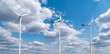 Wind turbines against blue sky