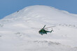 © Kirill - Military helicopter flies on the background of Elbrus. Kabardino-Balkaria, Caucasus, Russia.