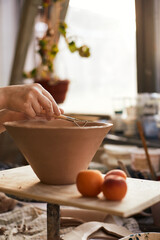 Pottery studio The process of creating pottery. The master ceramist works in her studio. workplace of potter