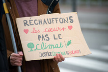 Mulhouse - France - 27 March 2021 - People Protesting With Banner In French : Rechauffons Nos Coeurs, Pas Le Climat , Traduction In English : Let's Warm Our Hearts Not The Climate