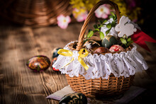 Traditional Easter Basket With Colored Eggs.