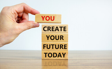 Wall Mural - You create your future today symbol. Concept words 'You create your future today' on wooden blocks on a beautiful white background. Businessman hand. Business, motivational and create future concept.