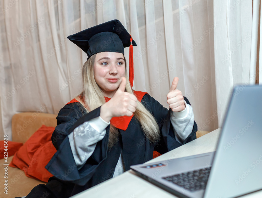 Virtual graduation and convocation ceremony. Excited student wearing ...