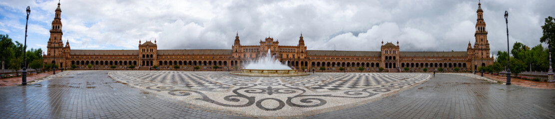 Plaza de Espana in Seville is a perfectly semi circle construct that I captured in this panorama from its equidistant center giving this picture the illusion of a flat building.